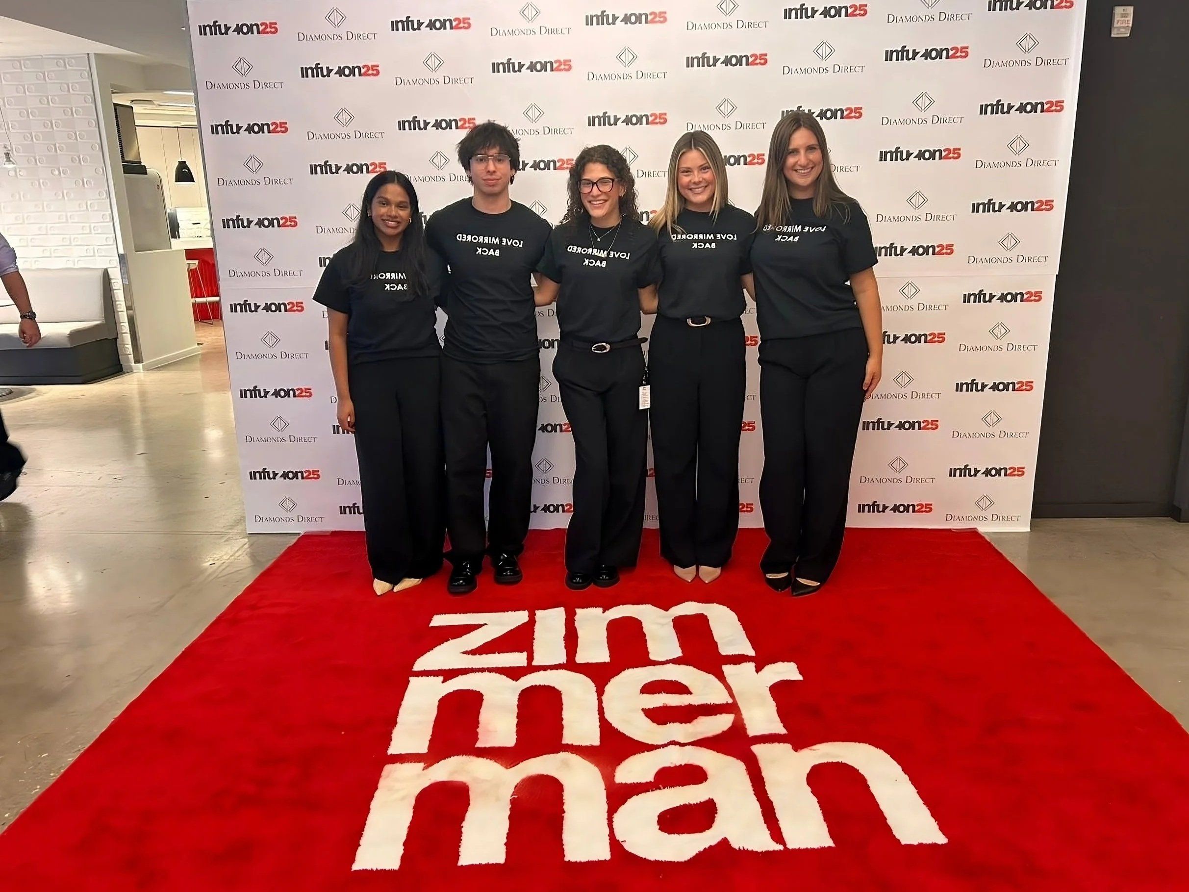 Sofia and four teammates in matching Love Mirrored Back T-shirts on the Zimmerman red carpet